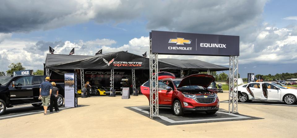 Chevrolet tent with a few cars on display